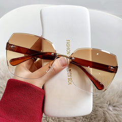 Fashion rimless cut edge sunglasses two-color gradient large frame windproof driving glasses