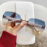 Fashion rimless cut edge sunglasses two-color gradient large frame windproof driving glasses