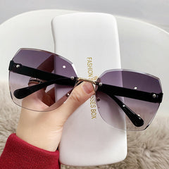 Fashion rimless cut edge sunglasses two-color gradient large frame windproof driving glasses